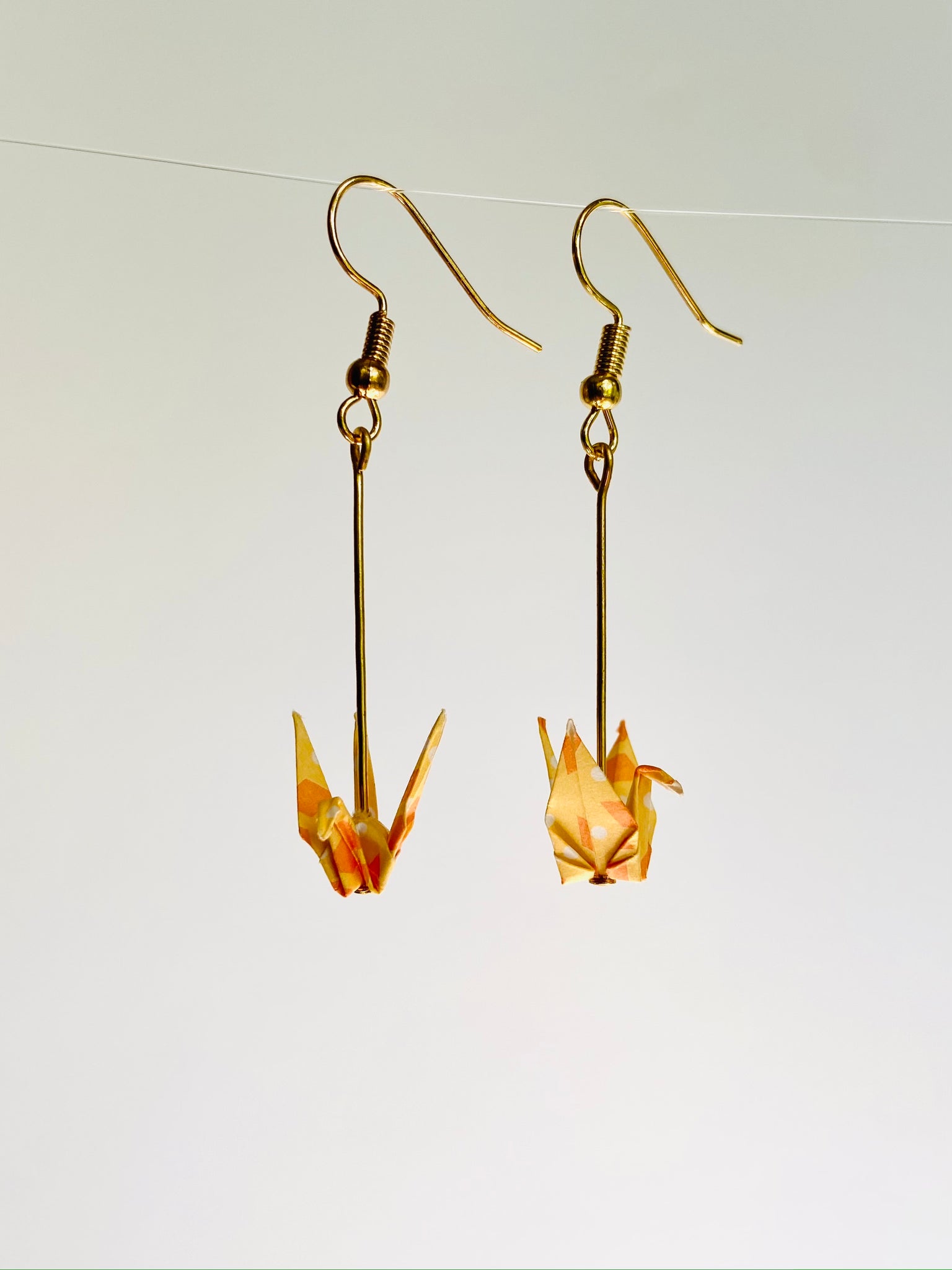 Metallic Orange Crane Earrings – mayajoyintheworld